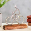 Transomnia Silver Metal Cyclist On Wooden Base Decoration -Home Furnishings Store transomnia decc715 silver metal cyclist on wooden base decoration lifestyle 1